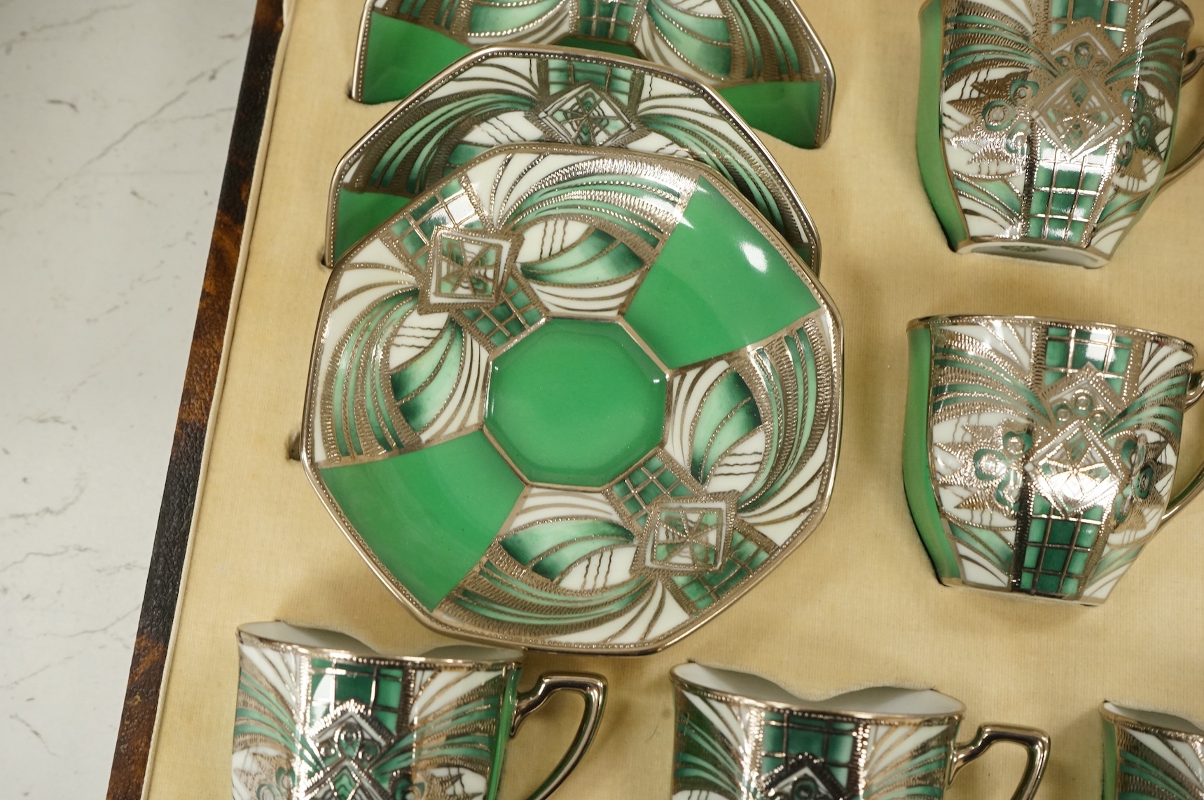 A Noritake coffee set, six-place setting including silver spoons, Sheffield 1932